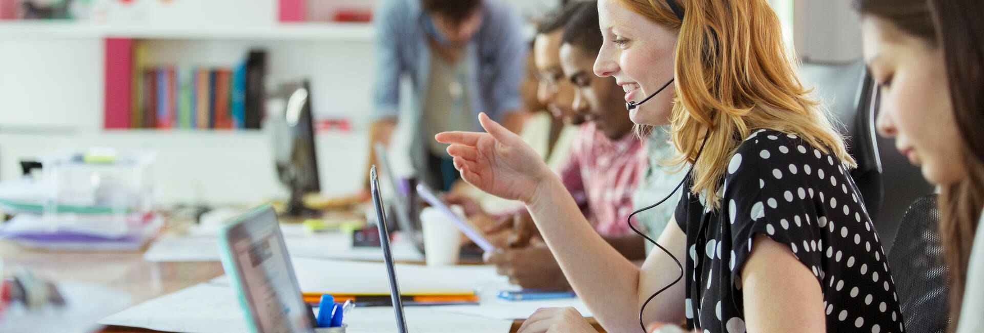 People working at conference table in office
