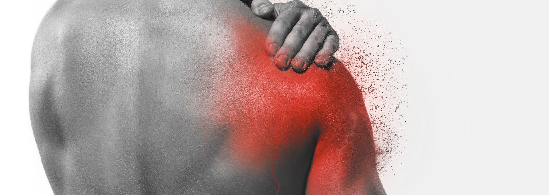 Kuvassa mies pitelee kipeää olkapäätä.